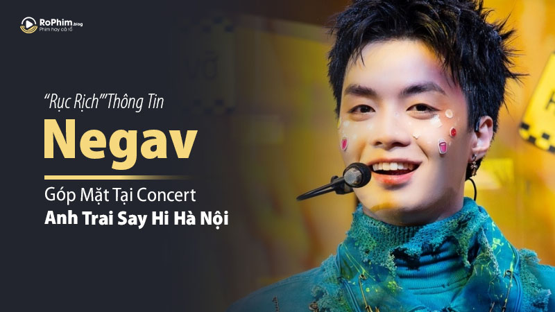Negav biểu diễn trên sân khấu với micro tại concert Anh Trai Say Hi Hà Nội, nổi bật với ánh sáng sân khấu rực rỡ và trang trí đầy màu sắc.